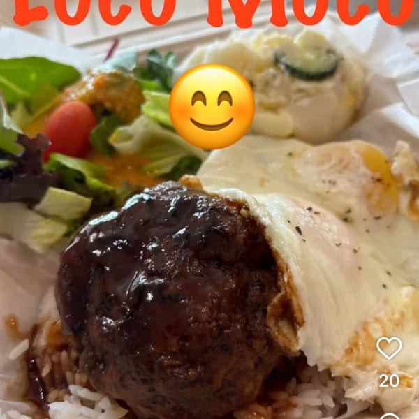 Kaimana Farm Cafe's Loco Moco with a hamburger patty, fried eggs, rice, salad, and potato salad.