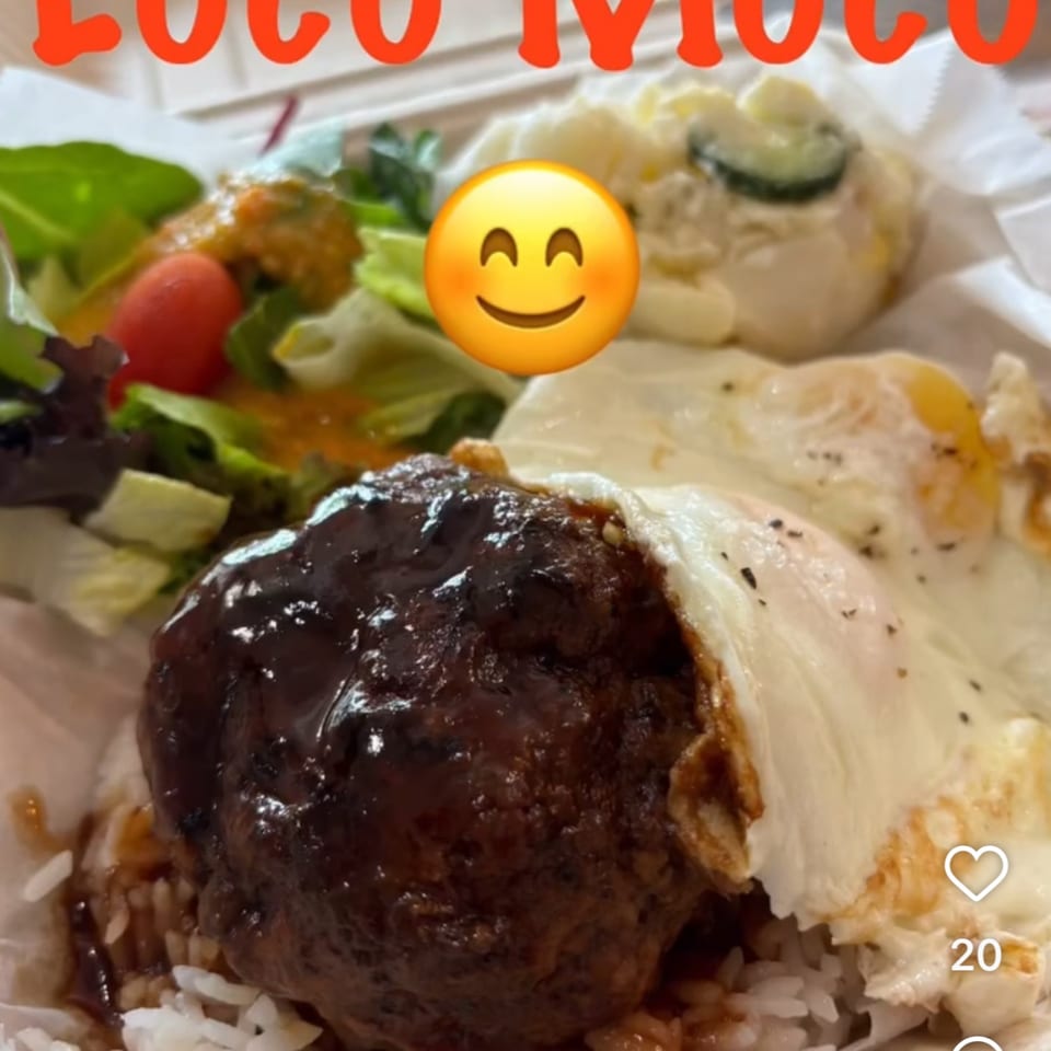 Kaimana Farm Cafe's Loco Moco with a hamburger patty, fried eggs, rice, salad, and potato salad.
